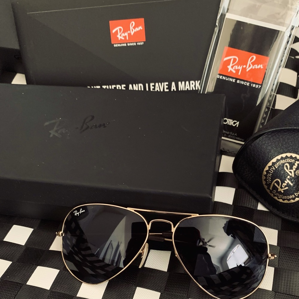RayBan Aviator gold Rim with Dark lenses - comes with case and cleaning cloth.